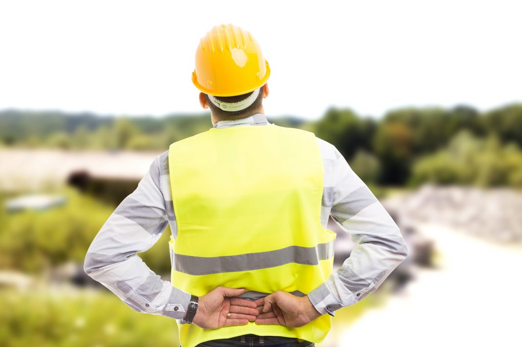 Injured construction worker or engineer suffering backpain in lower back area compensation claims Bradford